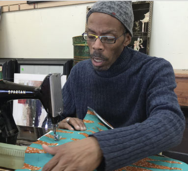 A person operating a sewing machine